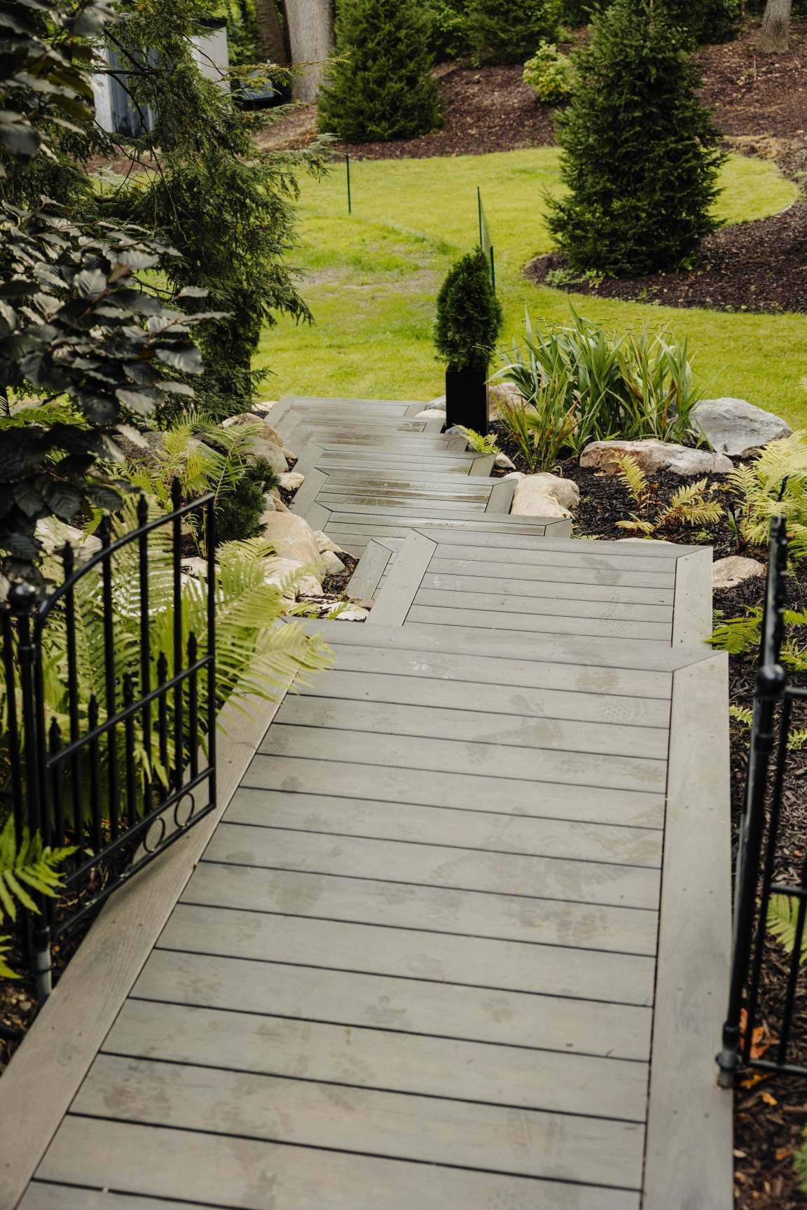 Composite walkway connecting a deck to the yard